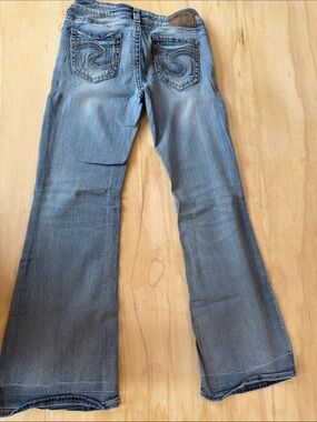 Silver Jeans Medium Blue Flare Jeans with Embroidered Pockets